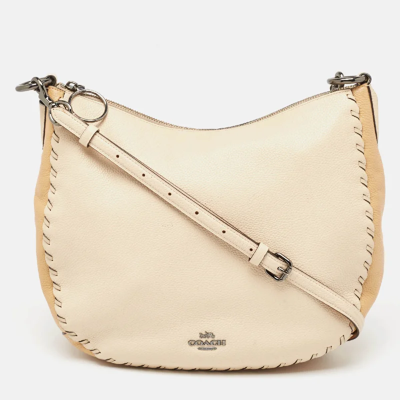 Coach Rogue bags with a detachable shoulder strap for versatile carryingTwo Tone Beige Leather Sutton Hobo