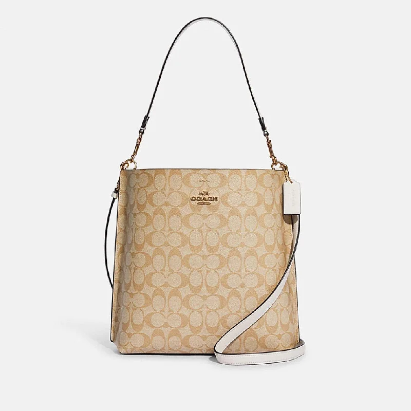 Coach handbags with a beaded trim for a glamorous and elegant lookCoach Mollie Bucket Bag In Signature Canvas in Khaki/Chalk (CA561)