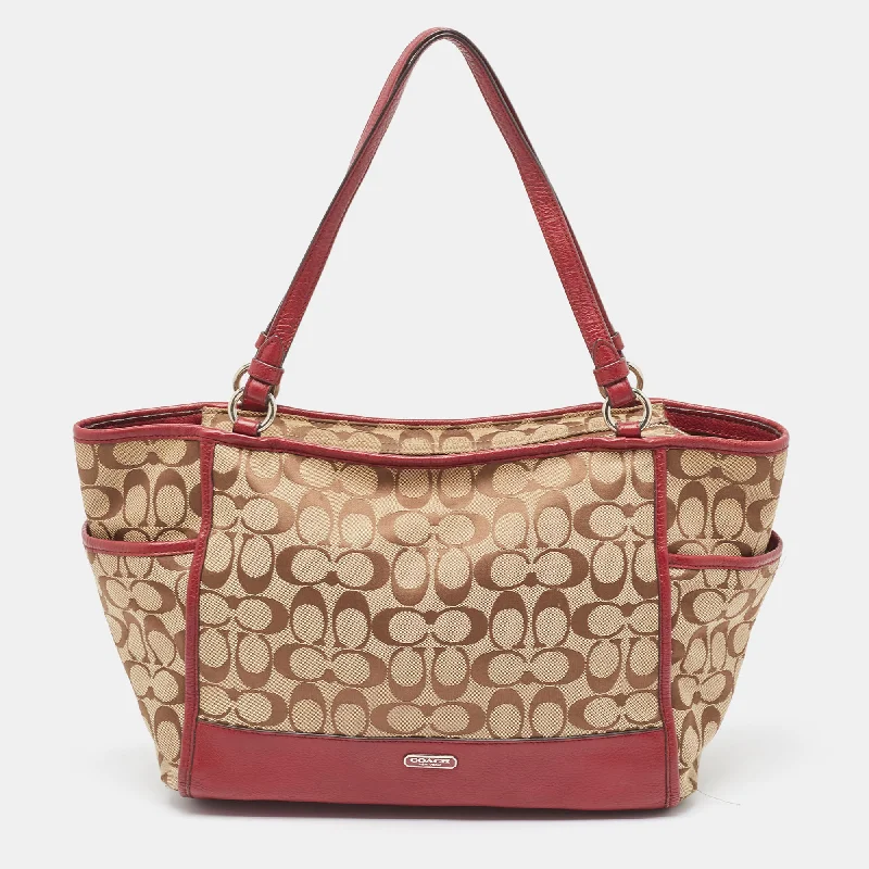 Ladies Coach Borough bags in a pastel shade for a soft and delicate appearanceBeige/Burgundy Signature Canvas and Leather Carrie Tote