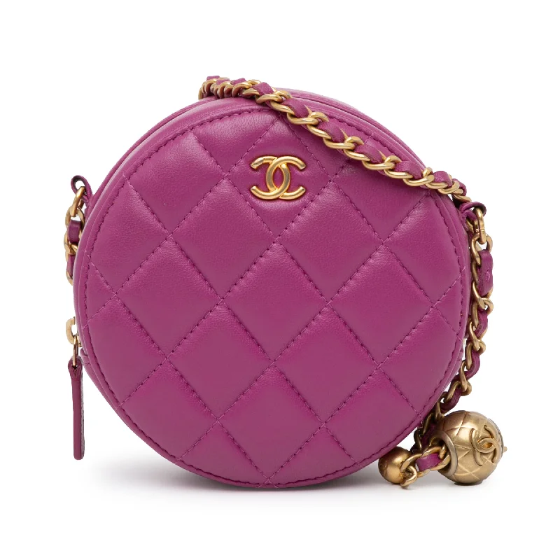 Balenciaga Le Cagole medium size with gold - tone chainsPink Chanel CC Quilted Lambskin Pearl Crush Round Clutch with Chain Crossbody Bag