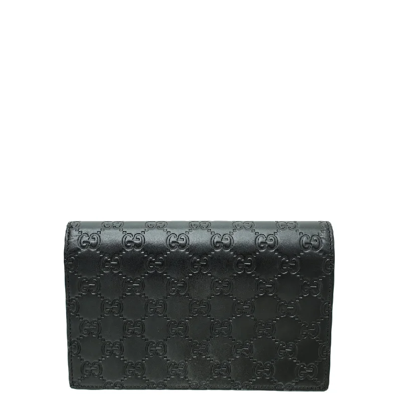 Women Gucci Sylvie bags with a leather - wrapped handleGucci Black Guccissima Bow Chain Wallet