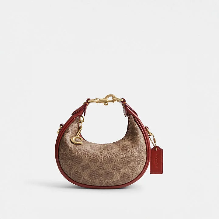 Coach tote bags with a double - handle and shoulder - strap option for easy useCoach Jonnie Bag in Signature Canvas