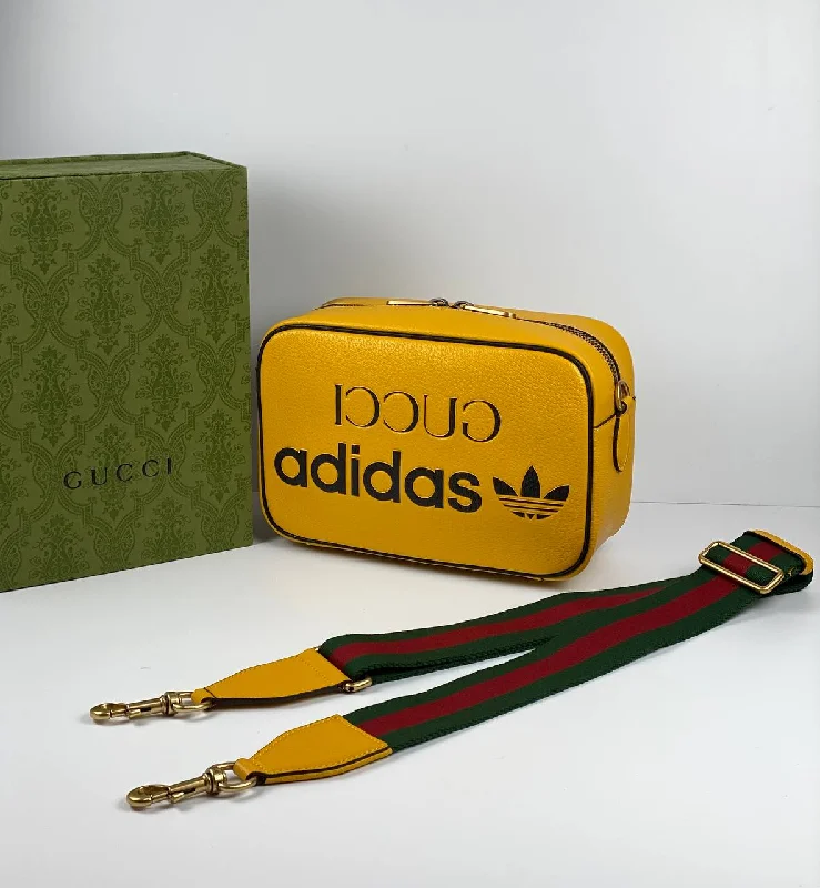 Women Gucci bags with a chain - link trim and a leather bodyGucci x adidas small shoulder bag yellow