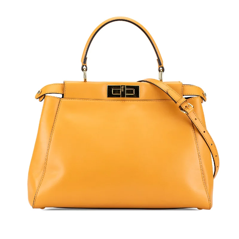 Balenciaga Le Cagole medium size with gold - tone chainsYellow Fendi Medium Leather Peekaboo Satchel