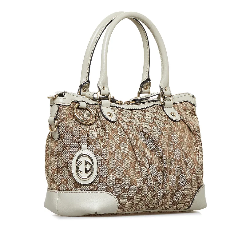 Women Gucci bags with a zip - around closure for securityBrown Gucci GG Canvas Sukey Tote Bag