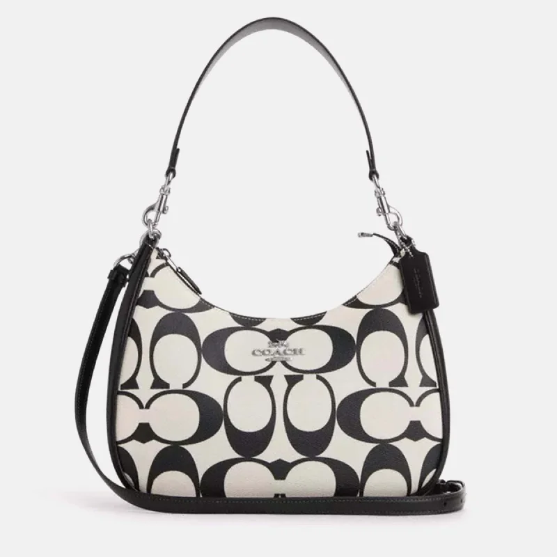 Coach bags with a zip - top closure and a front - pocket for quick accessBlack/White leather Teri Hobo In Signature Canvas