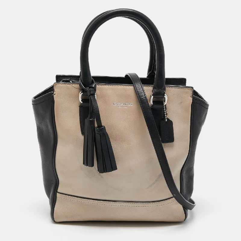 Coach bags with a front - flap pocket and a turnlock for a classic aestheticBlack/Beige Leather Tassel Tote