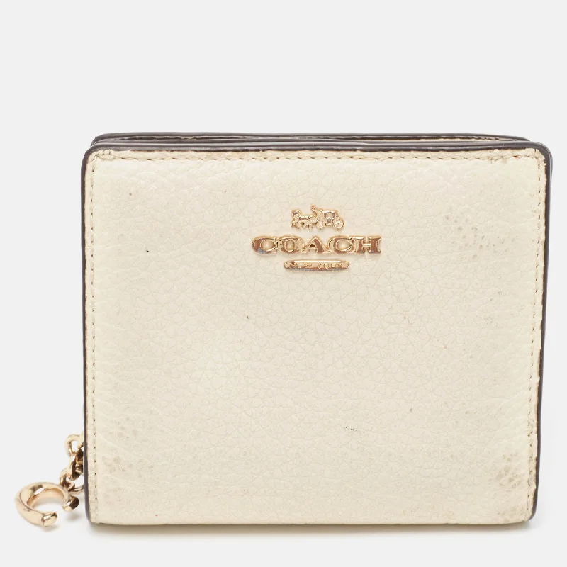 Coach Dempsey bags with a contrast - colored interior for visual interestOff White/Brown Leather Snap Compact Wallet