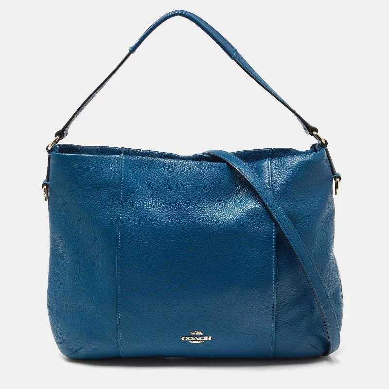 Coach Dempsey bags with a contrast - colored interior for visual interestBlue Leather Isabelle East West Hobo