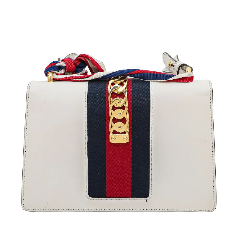 Women Gucci bags with a snap - button closure and a decorative charmGucci White Sylvie Small Bag