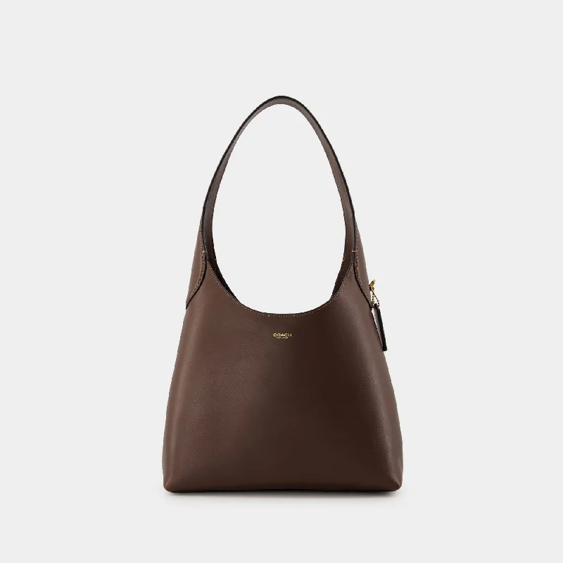 Small - sized Coach crossbody bags in smooth pebble leather for a compact carryBrooklyn 28 Shoulder Bag - Coach - Leather - Maple