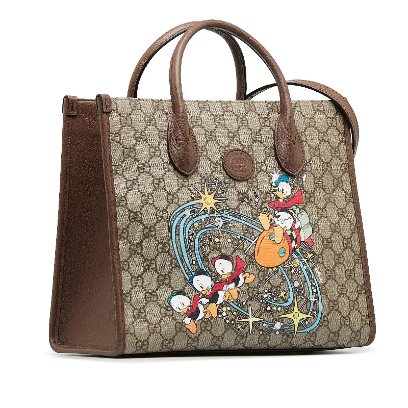 Women Gucci bags with a chain - link trim and a leather bodyGucci x Disney GG Supreme Donald Duck Tote (SHG-mJ8LfU)