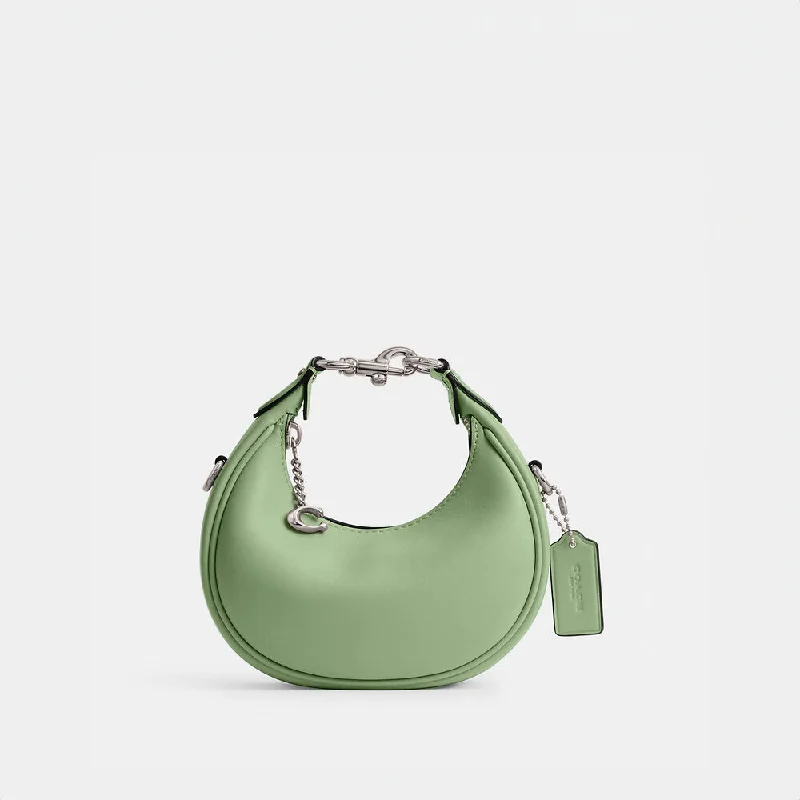 Ladies Coach shoulder bags with a tassel - decorated zipper for added charmCoach Jonnie Bag Pale Pistachio