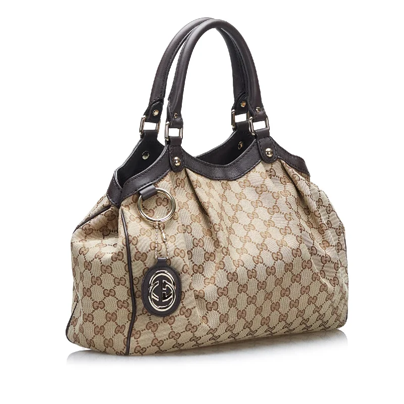 Ladies Gucci shoulder bags with a tassel decorationGucci GG Canvas Sukey (SHG-wl38gU)