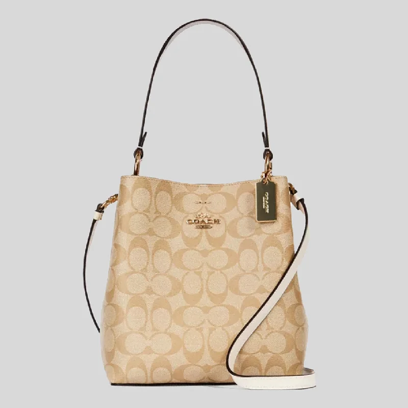 Coach tote bags with a snap - button closure and a decorative charm for styleCOACH Small Town Bucket Bag In Signature Canvas Light Khaki Chalk 2312