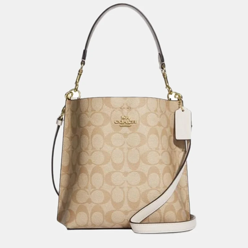 Coach Rogue bags with a detachable shoulder strap for versatile carryingBeige Canvas Bucket Bag