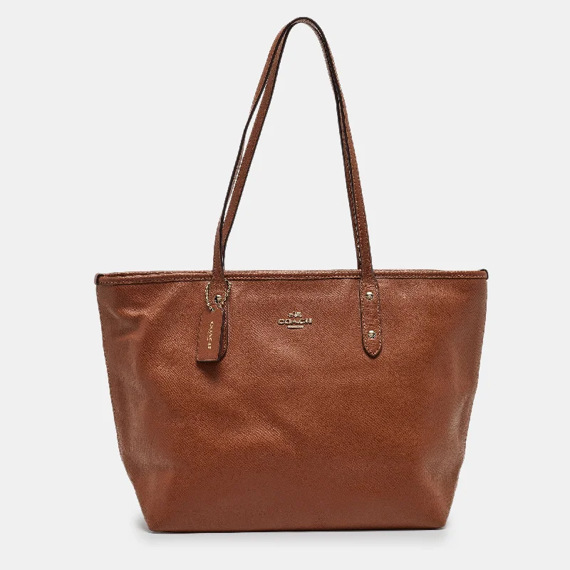 Ladies Coach Borough bags in a pastel shade for a soft and delicate appearanceBrown Leather City Zip Tote