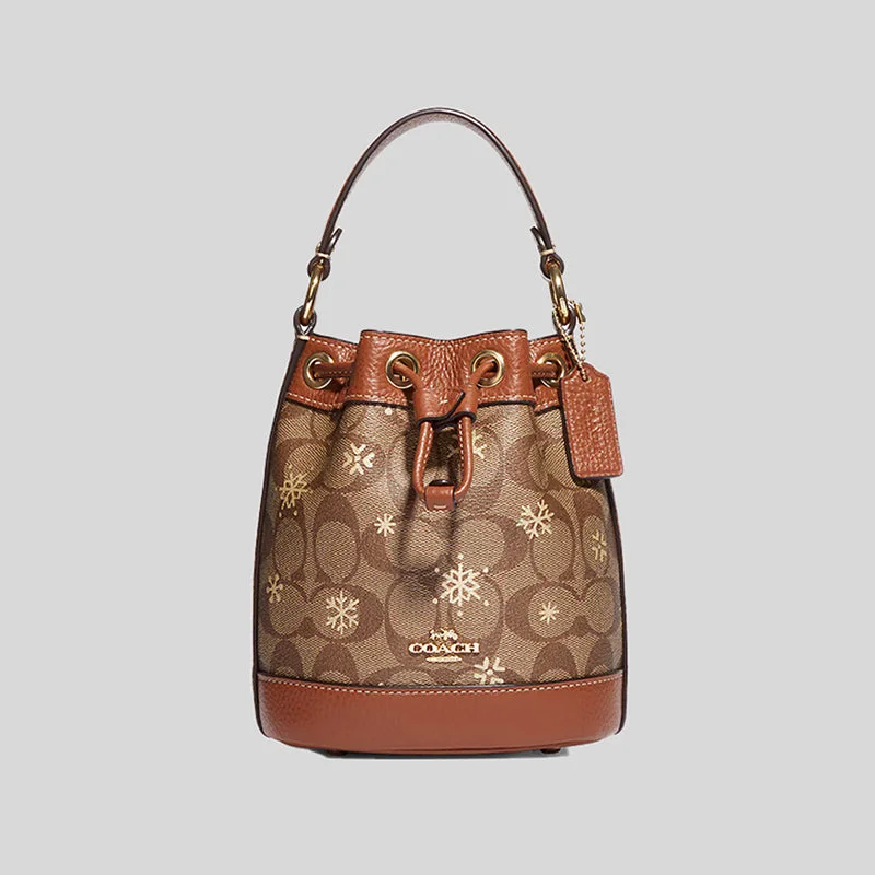 Coach bags with a zippered interior pocket for separating itemsCOACH Dempsey Drawstring Bucket Bag 15 In Signature Canvas With Snowflake Print Khaki Multi CE587