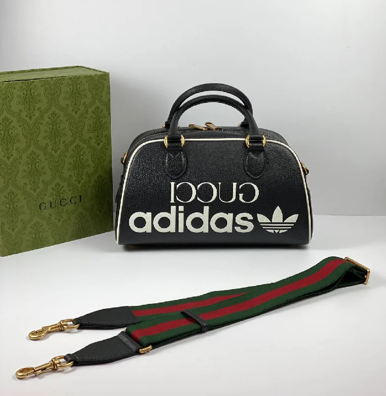 Women Gucci bags with a snap - button closure and a decorative charmGucci x adidas mini duffle bag