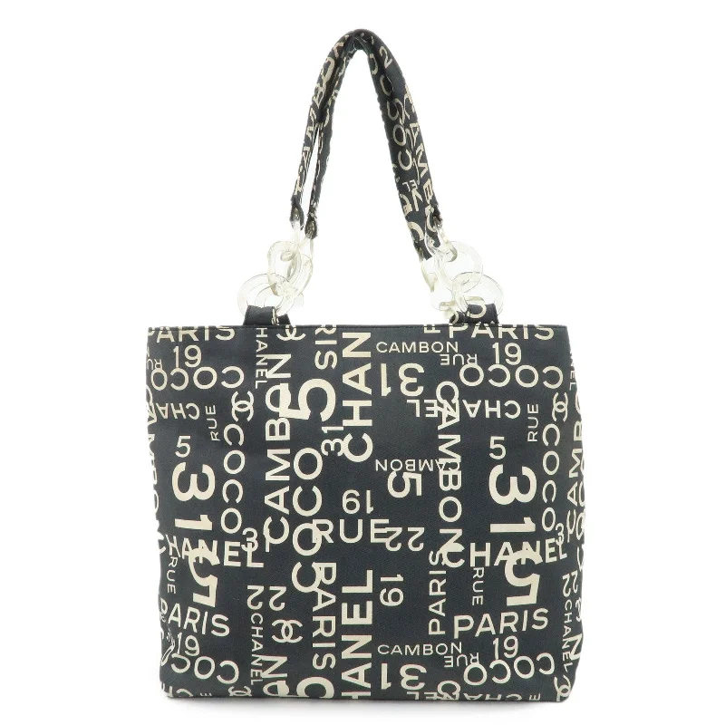 Chanel bags with intricate metal hardwareCHANEL By Sea Line Canvas Tote Bag Gray Ivory A18302