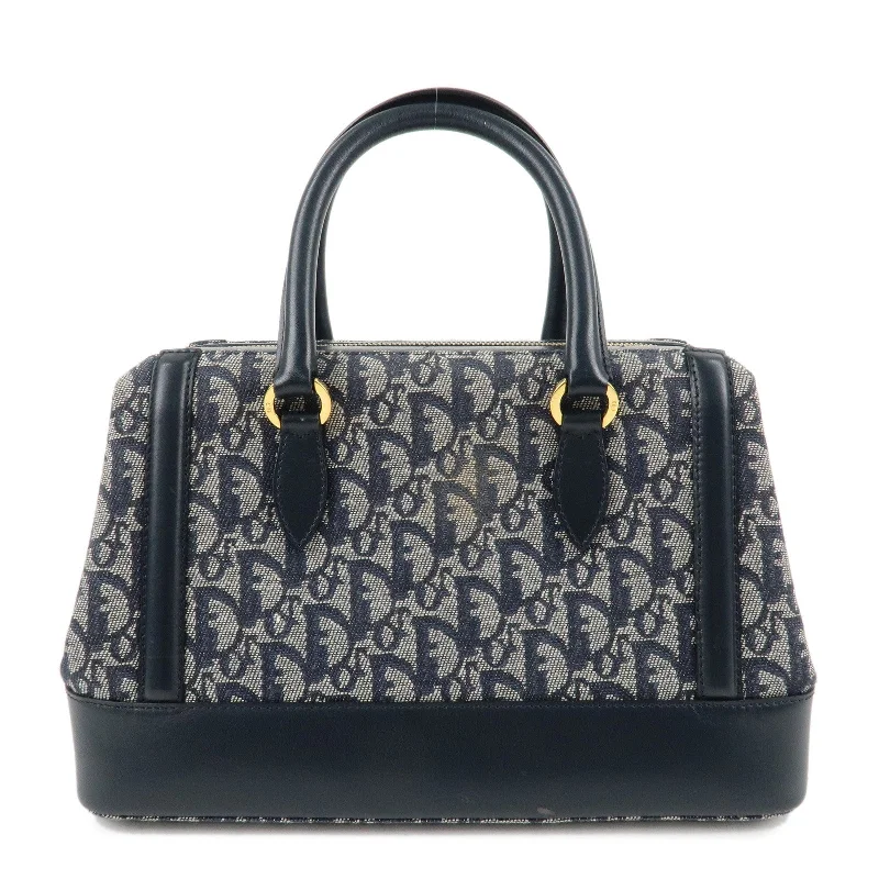 Christian Dior handbags with a snap - button closure and a decorative buckleChristian Dior Trotter Canvas Leather Boston Bag Navy White