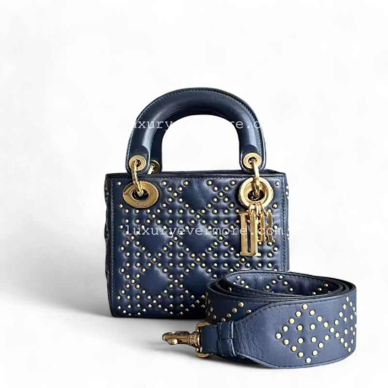 Christian Dior bags with a quilted pattern and gold - toned hardwareDior Lady Mini - Studded Calfskin Dark Blue Golden Hardware