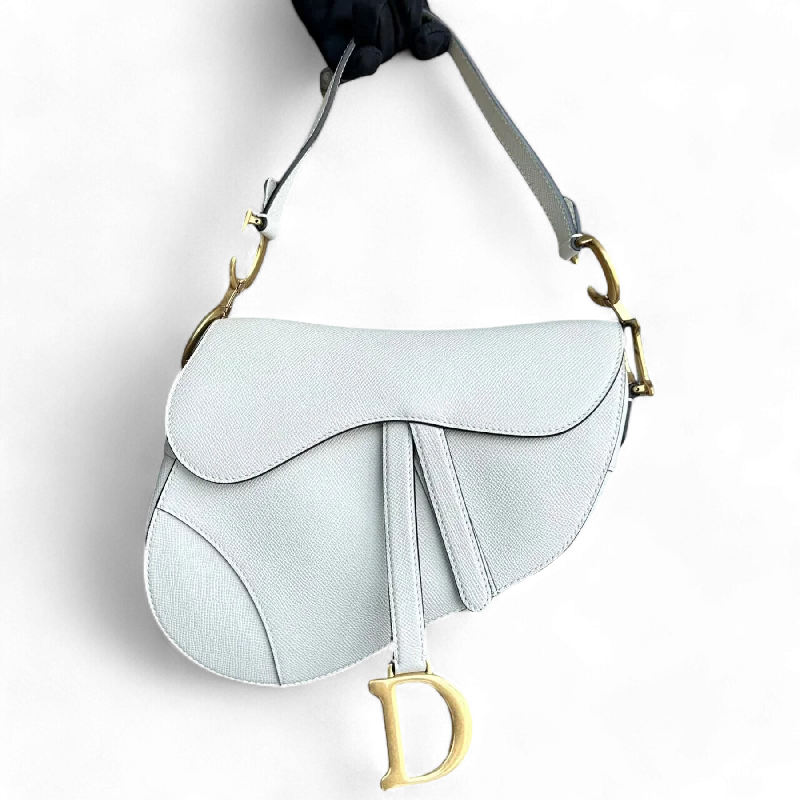 Christian Dior bags with a side - pocket for holding a water bottleDior Medium Saddle Grained Calfskin White Golden Hardware