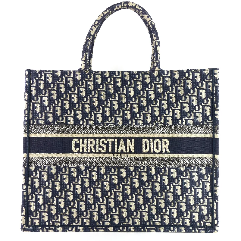 Christian Dior tote bags with a printed Dior logo on the frontOblique Canvas Book Tote Bag