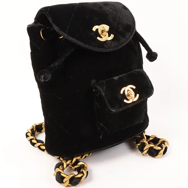 Chanel bags with gold, silver, and pearl accentsCHANEL Around 1995 Made Double Turn-Lock Velour Backpack Mini Black