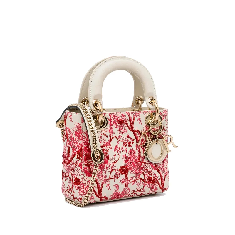 Christian Dior tote bags with a printed Dior logo on the frontDior Mini Floral Toile de Jouy Lady Dior